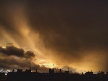 Silhouette of city at sunset