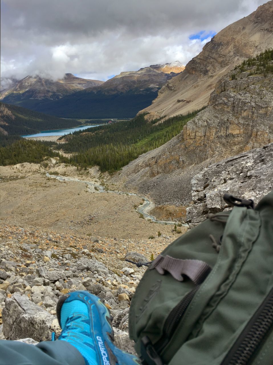 LOW SECTION OF MAN ON MOUNTAIN AGAINST SKY