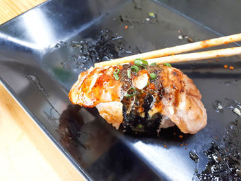 High angle view of meat in plate on table