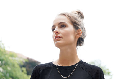 Close-up of a serious woman looking away