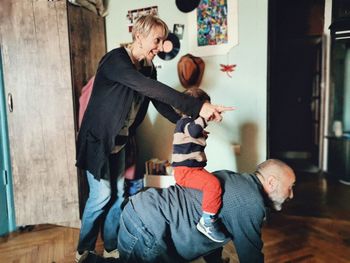 Full length of father with son standing at home