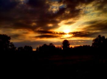 Scenic view of dramatic sky during sunset