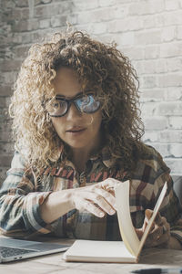 Portrait of woman using mobile phone