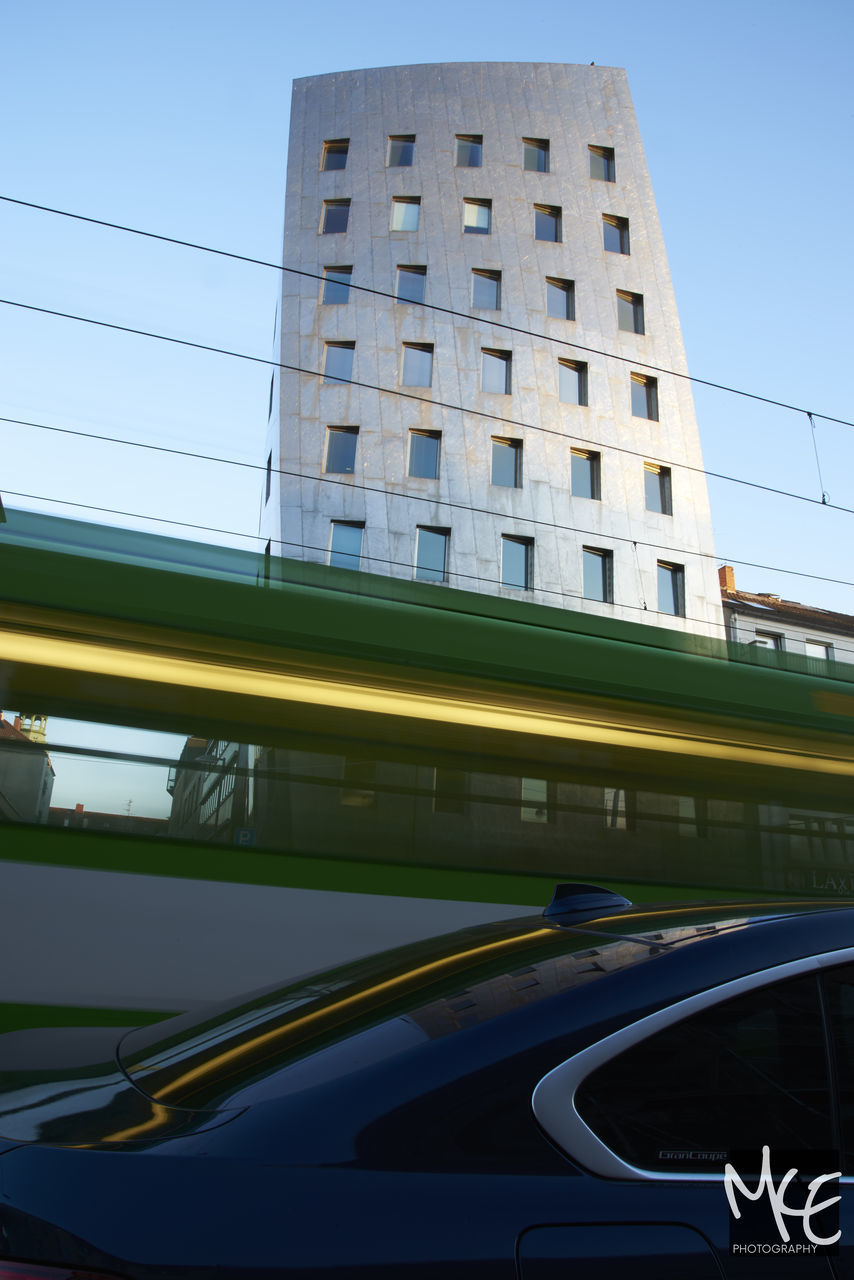 architecture, built structure, city, clear sky, building exterior, no people, outdoors, road, day, water, sky