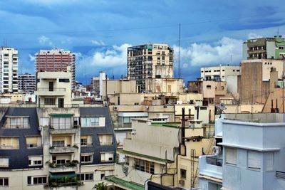 Buildings in city against sky