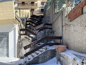 High angle view of staircase amidst buildings during winter