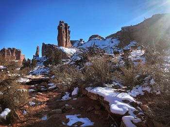 Rock formation against clear sky during winter