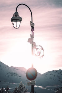 Street light against sky during winter