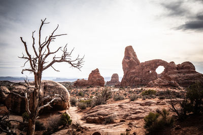 Rock formations on landscape against sky