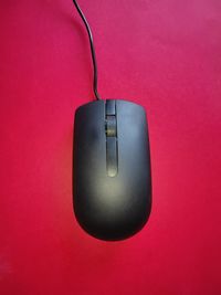 High angle view of electric lamp against red wall