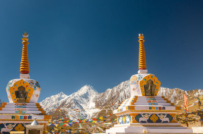 Low angle view of traditional building against blue sky