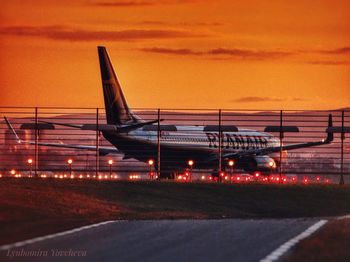 View of airport runway at sunset