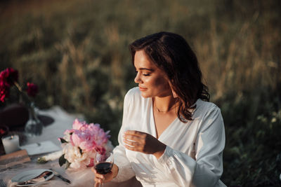 Young woman holding ice cream