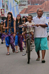 Crowd on street in city