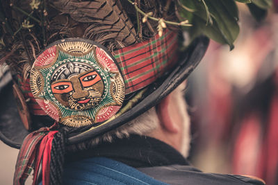 Rear view of man wearing hat with label