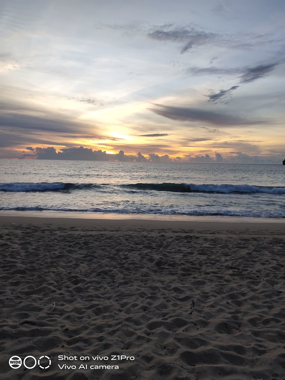 SCENIC VIEW OF SEA AGAINST SKY AT SUNSET