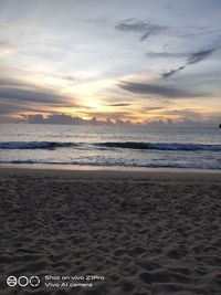 Scenic view of beach against sky during sunset