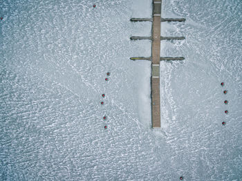 Full frame shot of frozen harbor with jetty