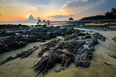View of beach against sky during sunset