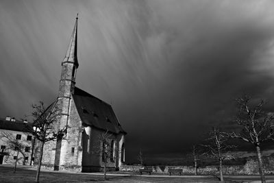 Church in city against sky