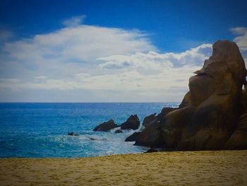 Scenic view of sea against cloudy sky