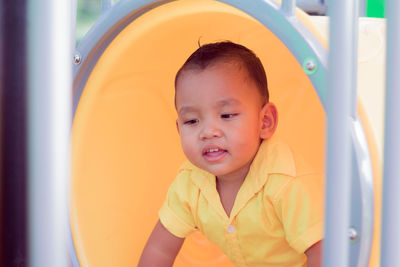 Portrait of cute baby boy in playground