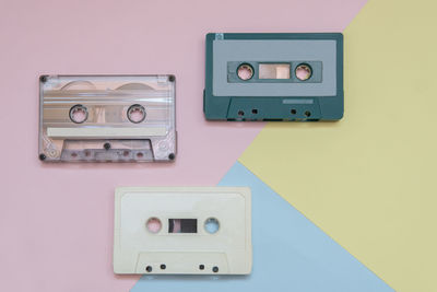 Directly above shot of audio cassettes on colored background
