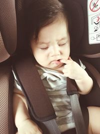 Cute baby girl in car