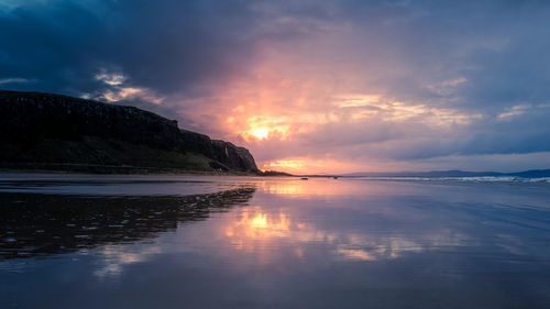 Scenic view of sea against sky at sunset