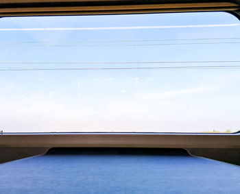 Low angle view of cables against blue sky