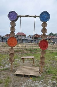 Close-up of red lanterns hanging against sky