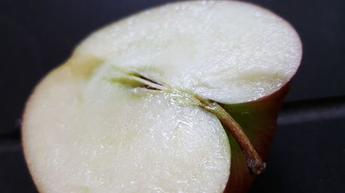 Close-up of halved apple on table