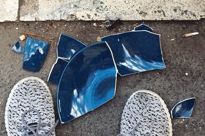 Low section of person standing on footpath