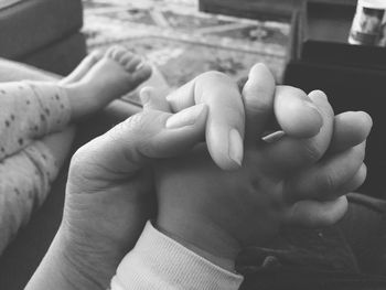 Cropped image of woman holding hands