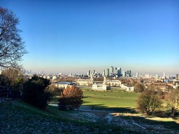 Cityscape against clear blue sky