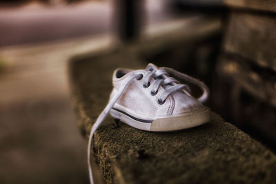 Close-up of shoe of ledge of wall