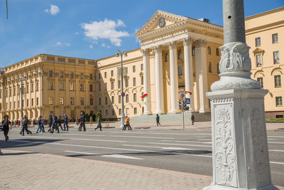 People in front of historic building