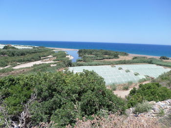 Scenic view of sea against clear blue sky