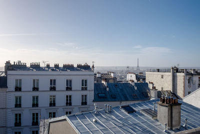 High angle view of buildings in city against sky