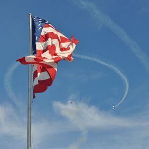 Low angle view of pole against blue sky