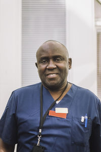 Portrait of smiling male doctor at healthcare center