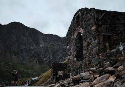 Low angle view of old ruins against sky