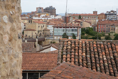 Houses in town against sky