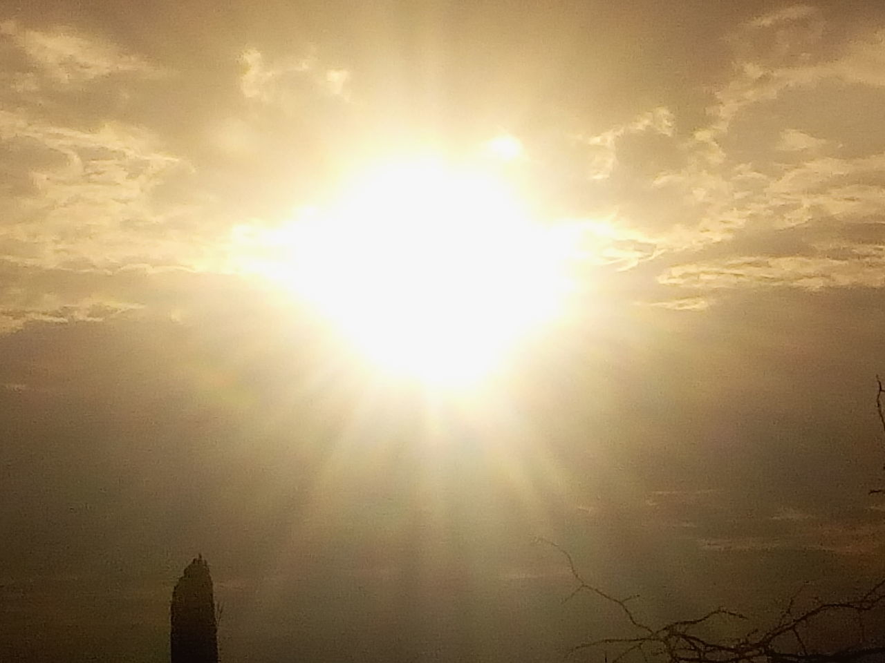 SUNLIGHT STREAMING THROUGH CLOUDS