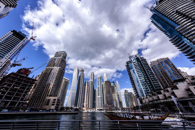 Low angle view of skyscrapers against sky