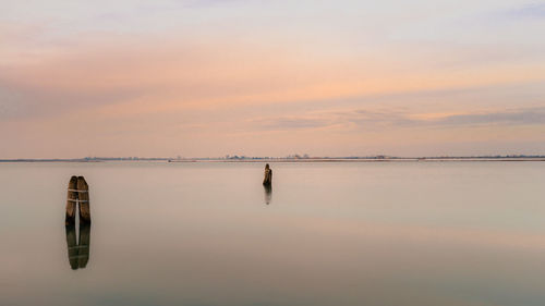 Scenic view of sea against sky at sunset