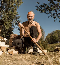 Low angle view of man working at farm