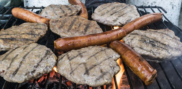 High angle view of meat on barbeque grill