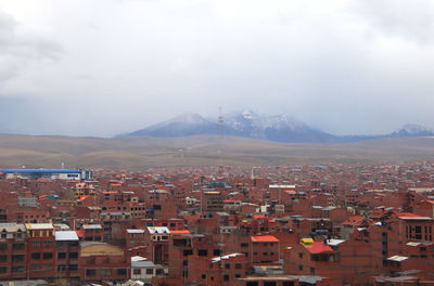 Aerial view of townscape against sky