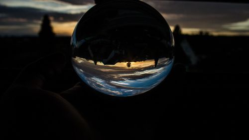 Close-up of reflection of crystal ball in water